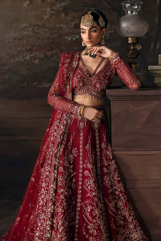 Elegant net suit with hand-embellished panels, embroidered dupatta, and waist belt border — a perfect blend of grace and festive charm.
