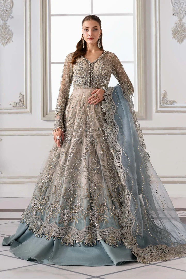Elegant net ensemble with hand-embellished bodice, organza dupatta, and raw silk base. Perfect for weddings and formal wear. Color may slightly vary.