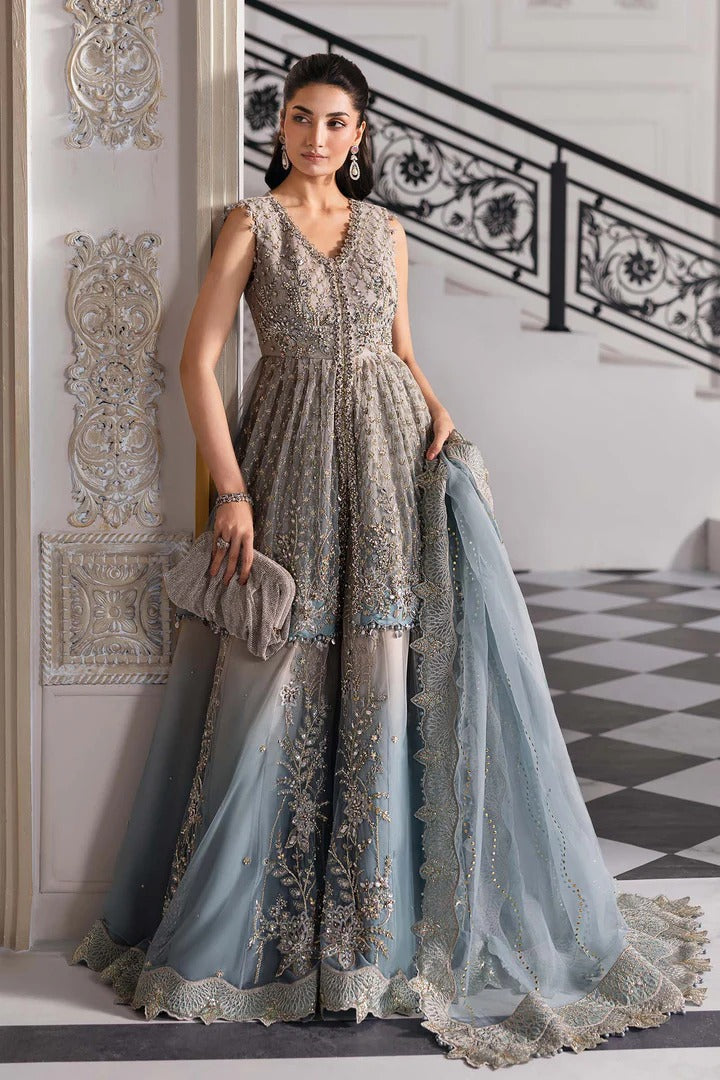 Elegant net ensemble with hand-embellished bodice, organza dupatta, and raw silk base. Perfect for weddings and formal wear. Color may slightly vary.
