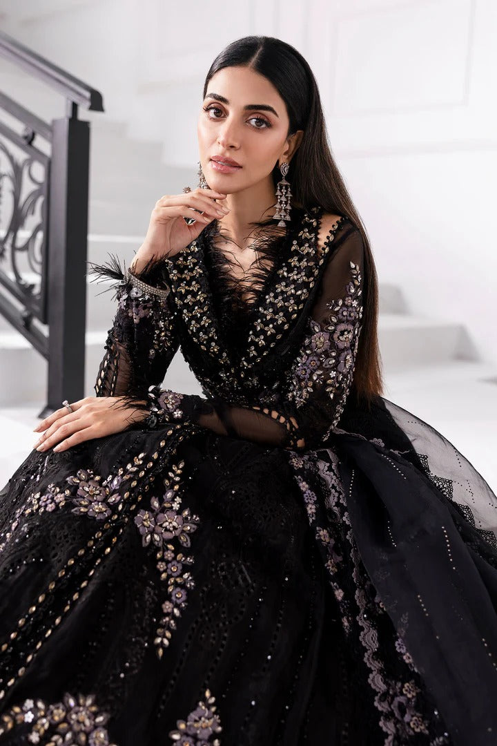 Elegant organza suit with 3D floral hand embellishments, embroidered panels, and diamante dupatta. Includes raw silk trouser & undershirt. Shop now.