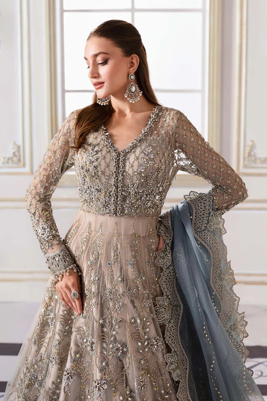 Elegant net ensemble with hand-embellished bodice, organza dupatta, and raw silk base. Perfect for weddings and formal wear. Color may slightly vary.