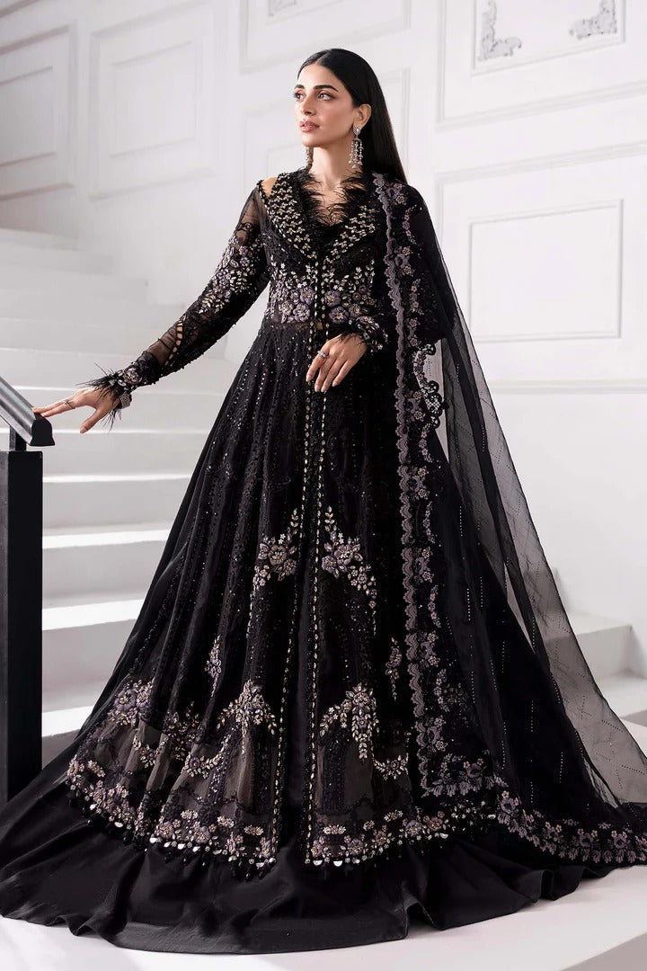 Elegant organza suit with 3D floral hand embellishments, embroidered panels, and diamante dupatta. Includes raw silk trouser & undershirt. Shop now.