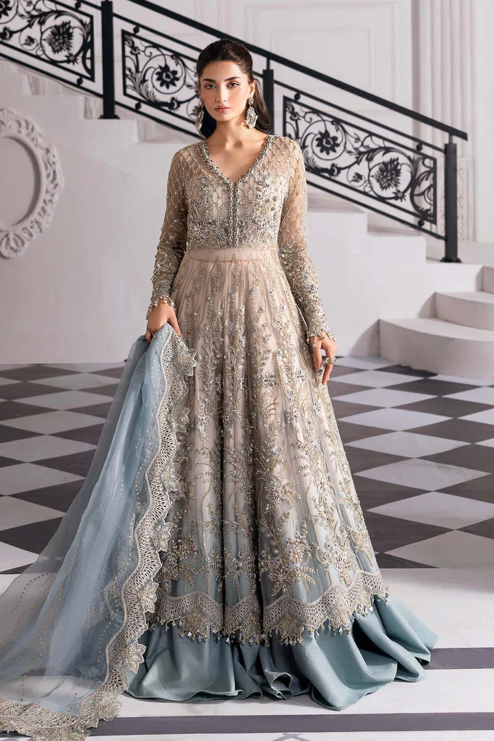 Elegant net ensemble with hand-embellished bodice, organza dupatta, and raw silk base. Perfect for weddings and formal wear. Color may slightly vary.