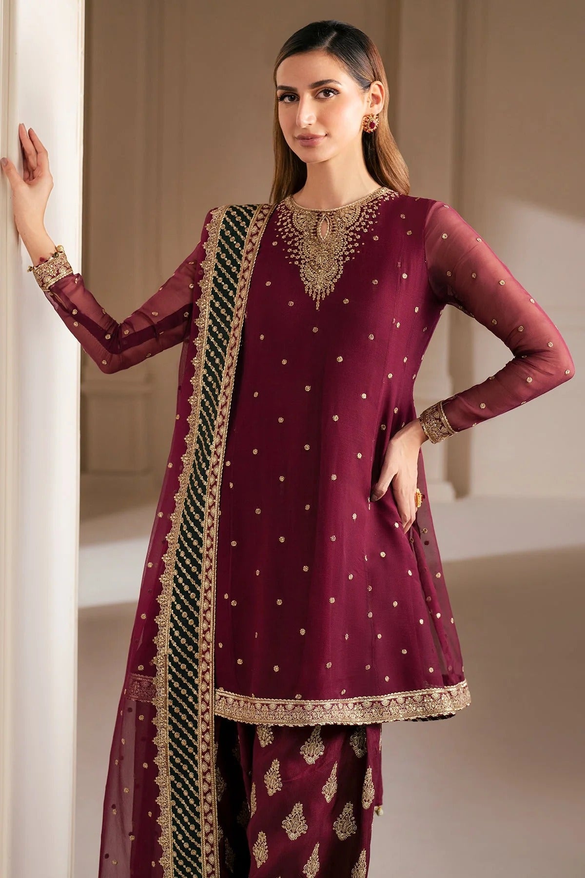 UC-3068 features delicate embroidery on chiffon panels, sleeves, and dupatta—paired with a rawsilk bottom and dyed border. Perfect for formal occasions.
