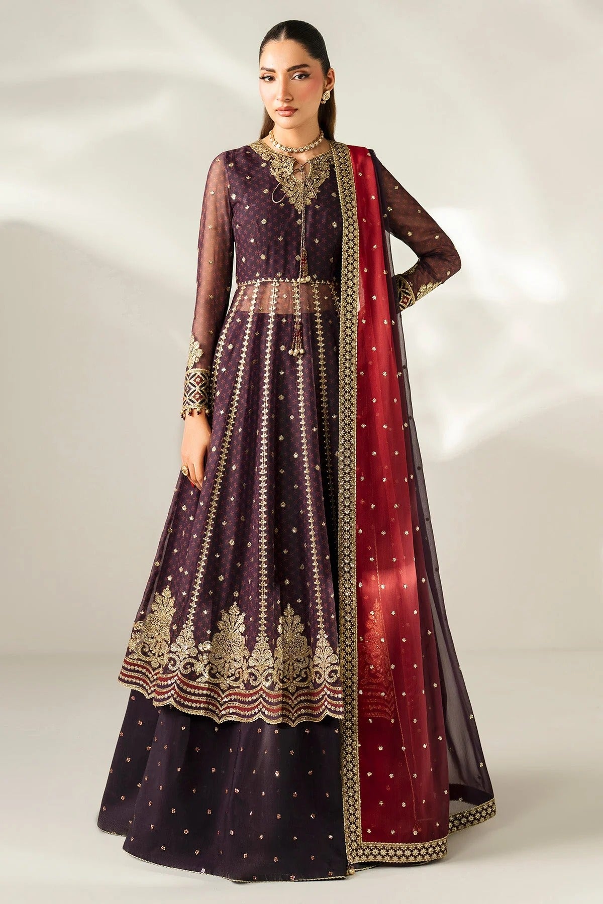 Intricately embroidered chiffon suit with digital prints, bordered dupatta, and raw silk bottom—crafted for timeless elegance and formal sophistication.