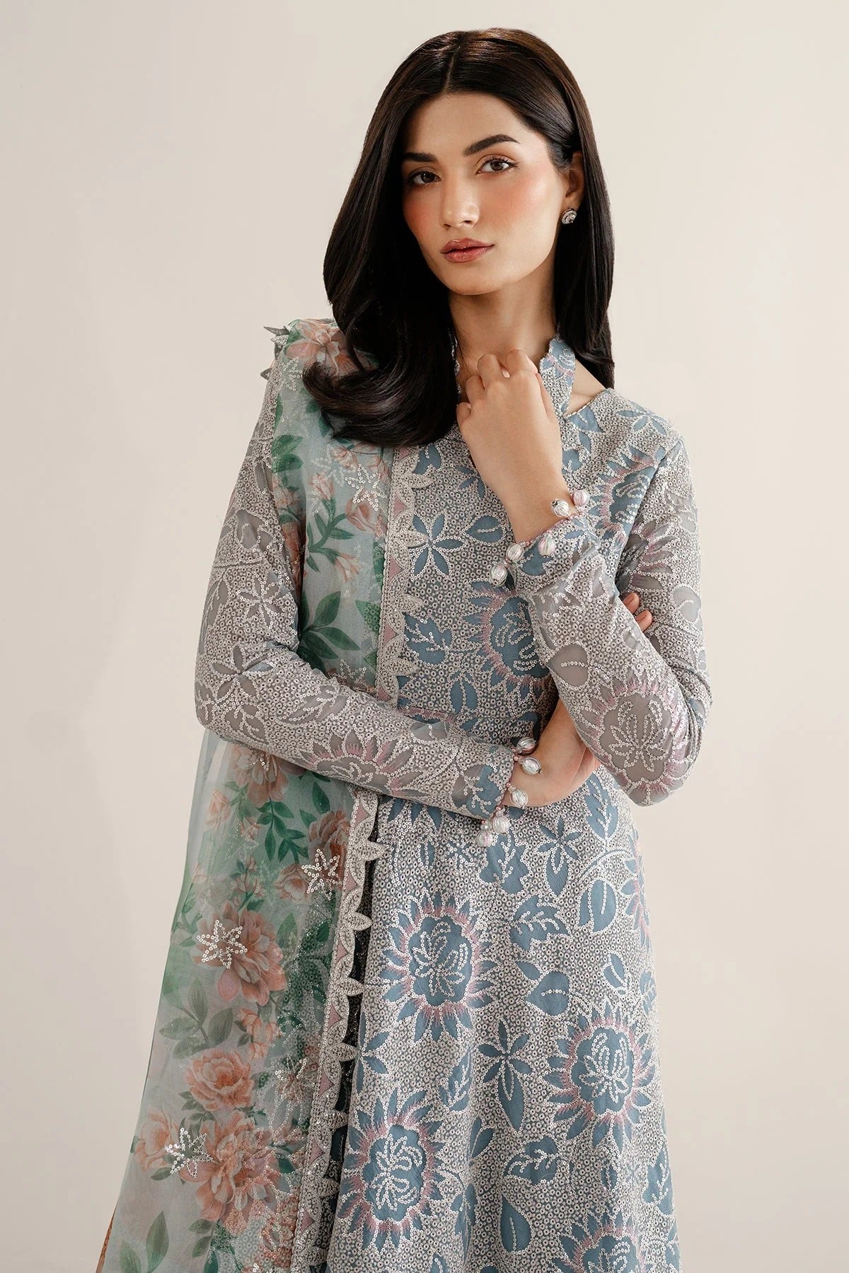 Featuring embroidered chiffon, organza dupatta, and rawsilk bottom, UC-3075 blends tradition and style—perfect for formal events and festive wear.