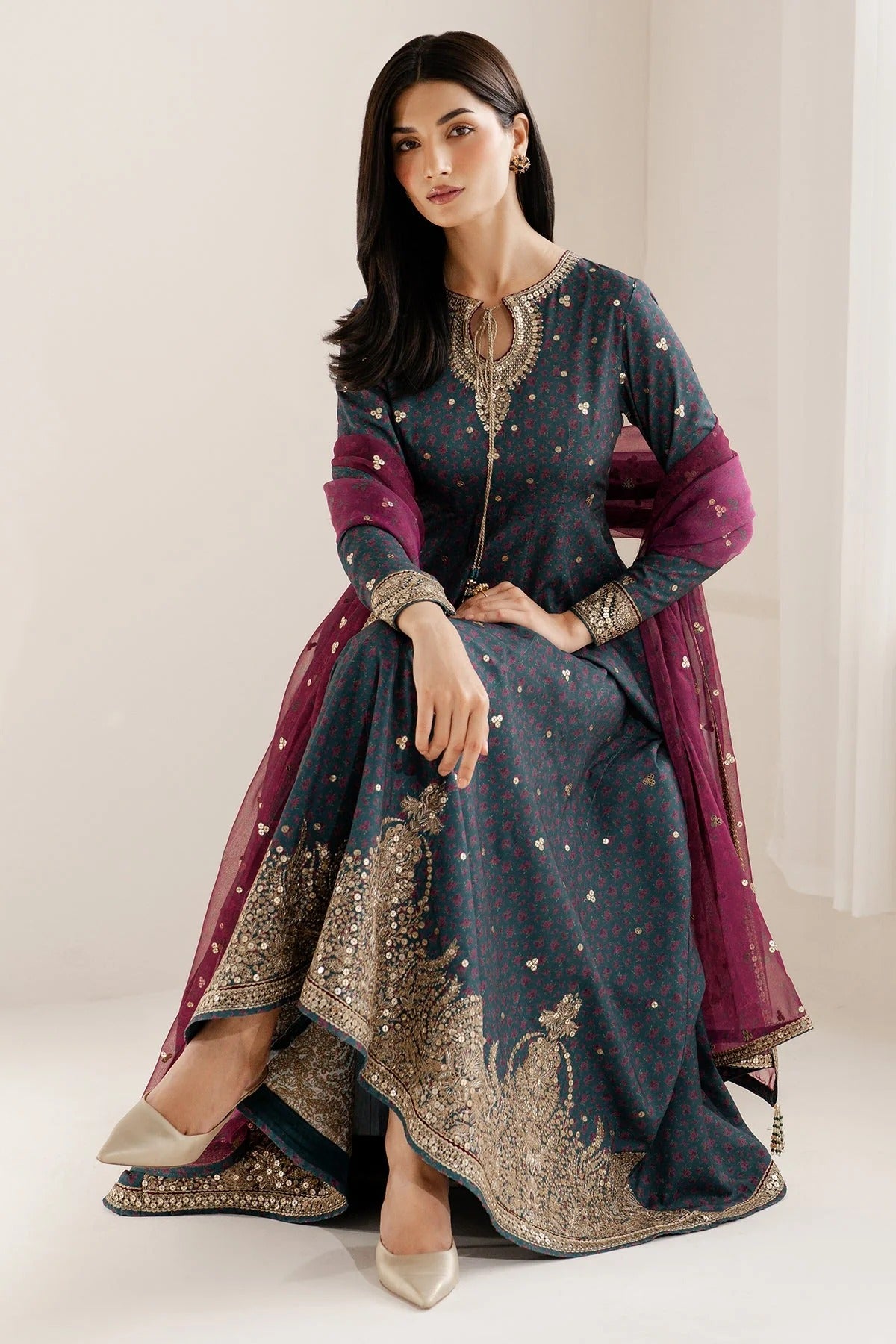 Discover UR-7058: a premium embroidered raw silk suit with chiffon dupatta and elegant borders. Perfect for formal, festive, or party occasions. Shop now!