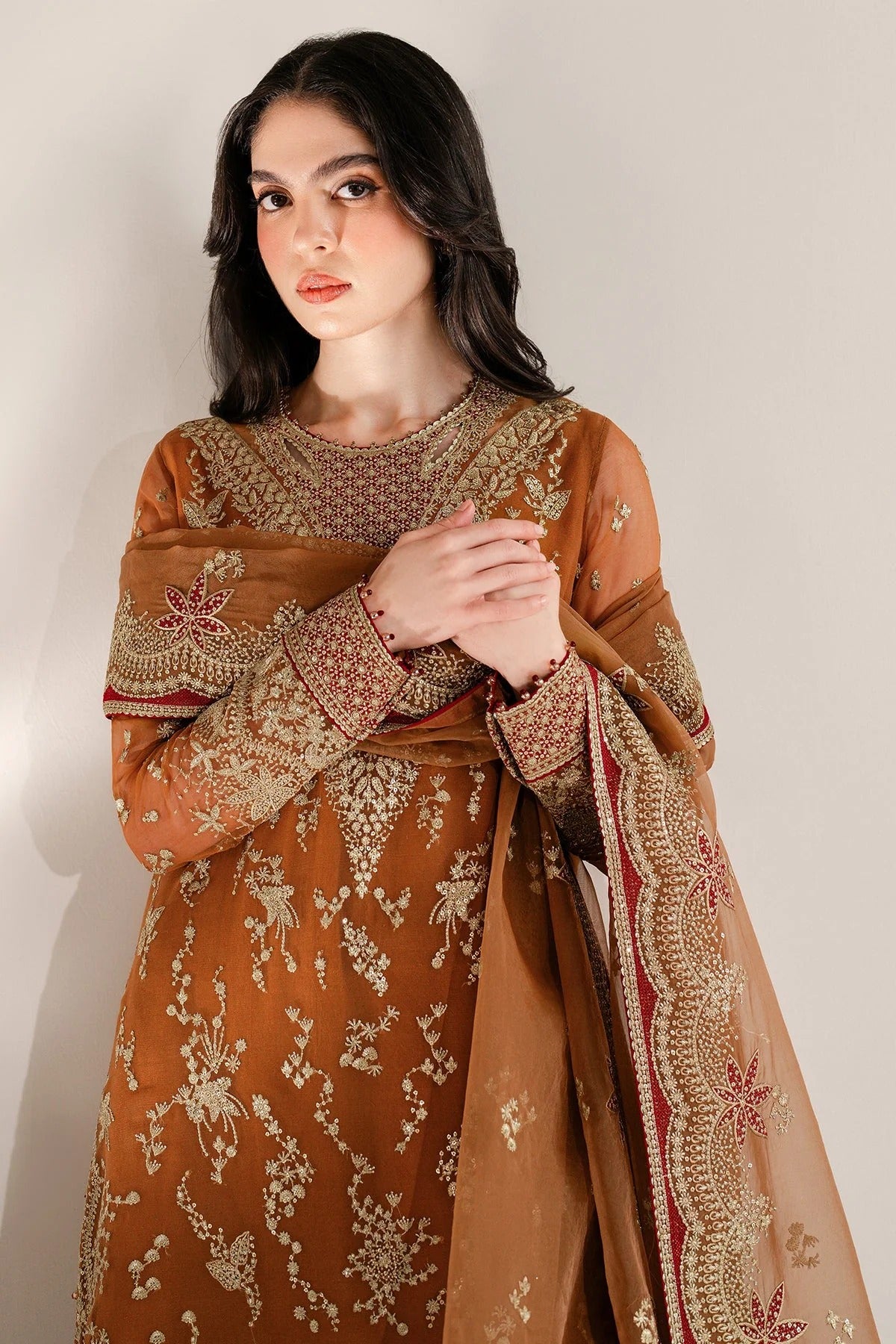 Chiffon and rawsilk elegance with intricate embroidery and organza dupatta. Ideal for formal wear and events. Make a bold style statement in UC-3077.