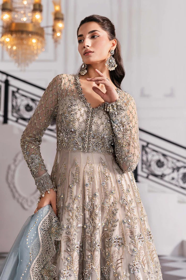 Elegant net ensemble with hand-embellished bodice, organza dupatta, and raw silk base. Perfect for weddings and formal wear. Color may slightly vary.