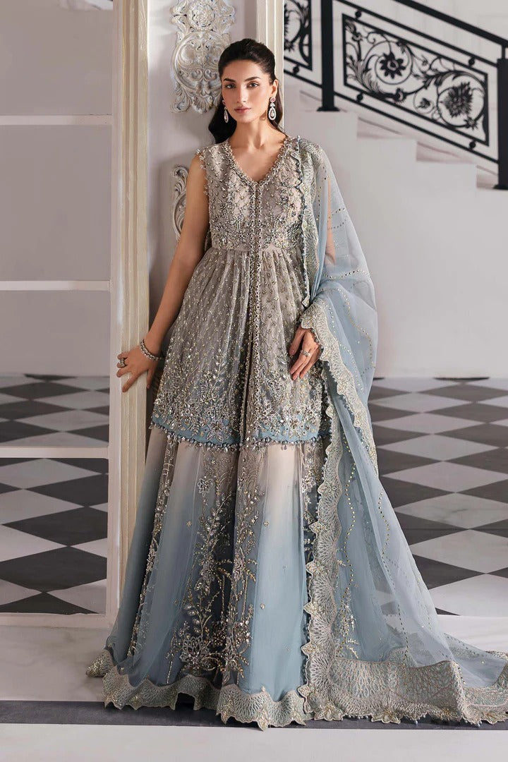 Elegant net ensemble with hand-embellished bodice, organza dupatta, and raw silk base. Perfect for weddings and formal wear. Color may slightly vary.