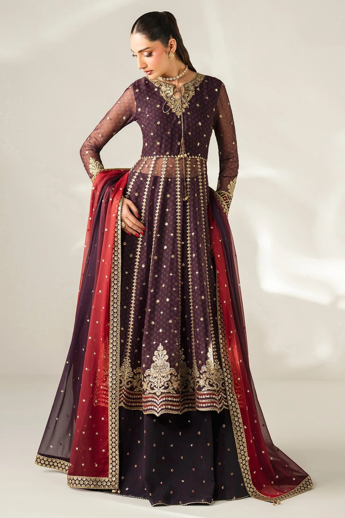 Intricately embroidered chiffon suit with digital prints, bordered dupatta, and raw silk bottom—crafted for timeless elegance and formal sophistication.