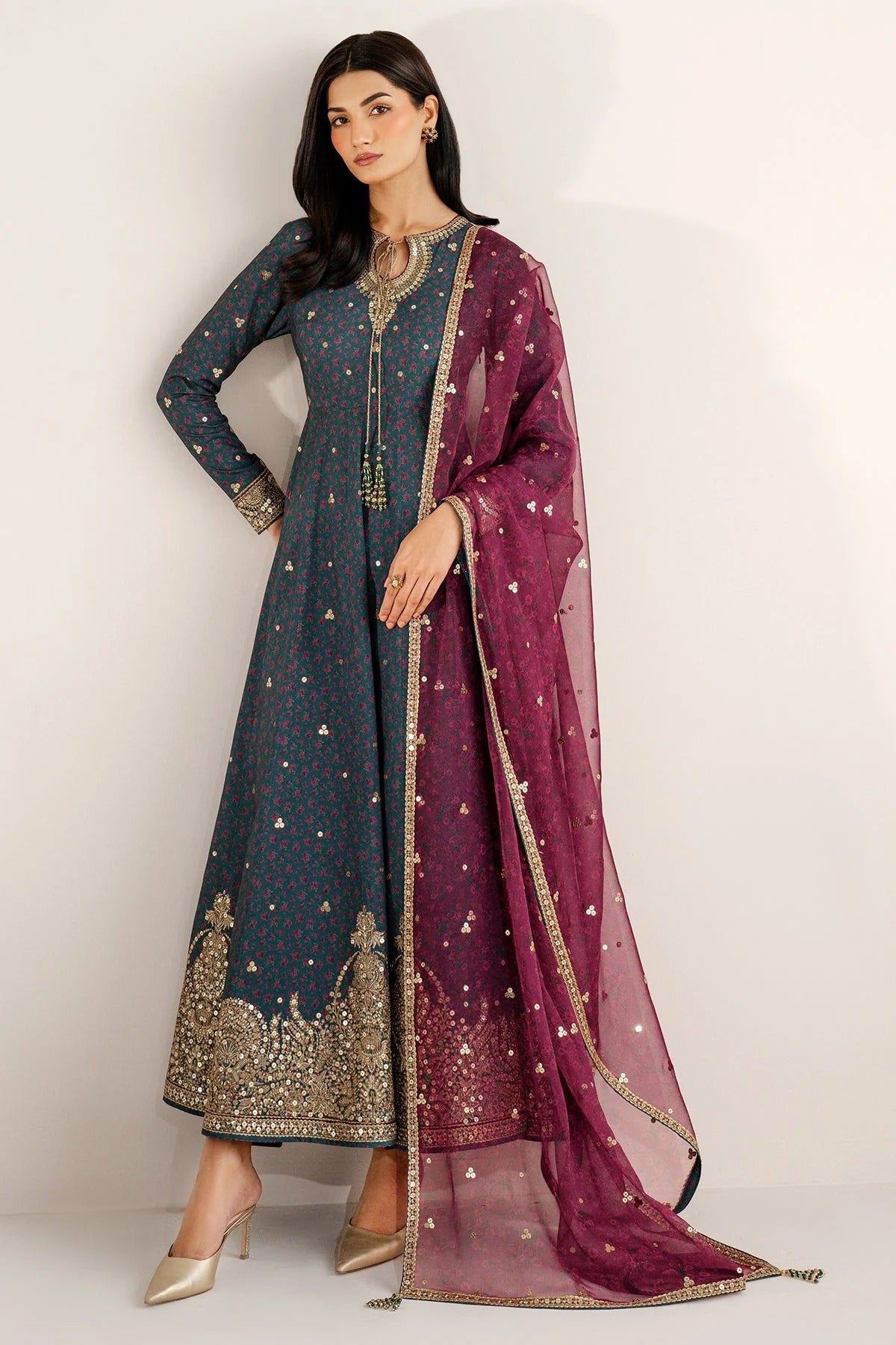 Discover UR-7058: a premium embroidered raw silk suit with chiffon dupatta and elegant borders. Perfect for formal, festive, or party occasions. Shop now!
