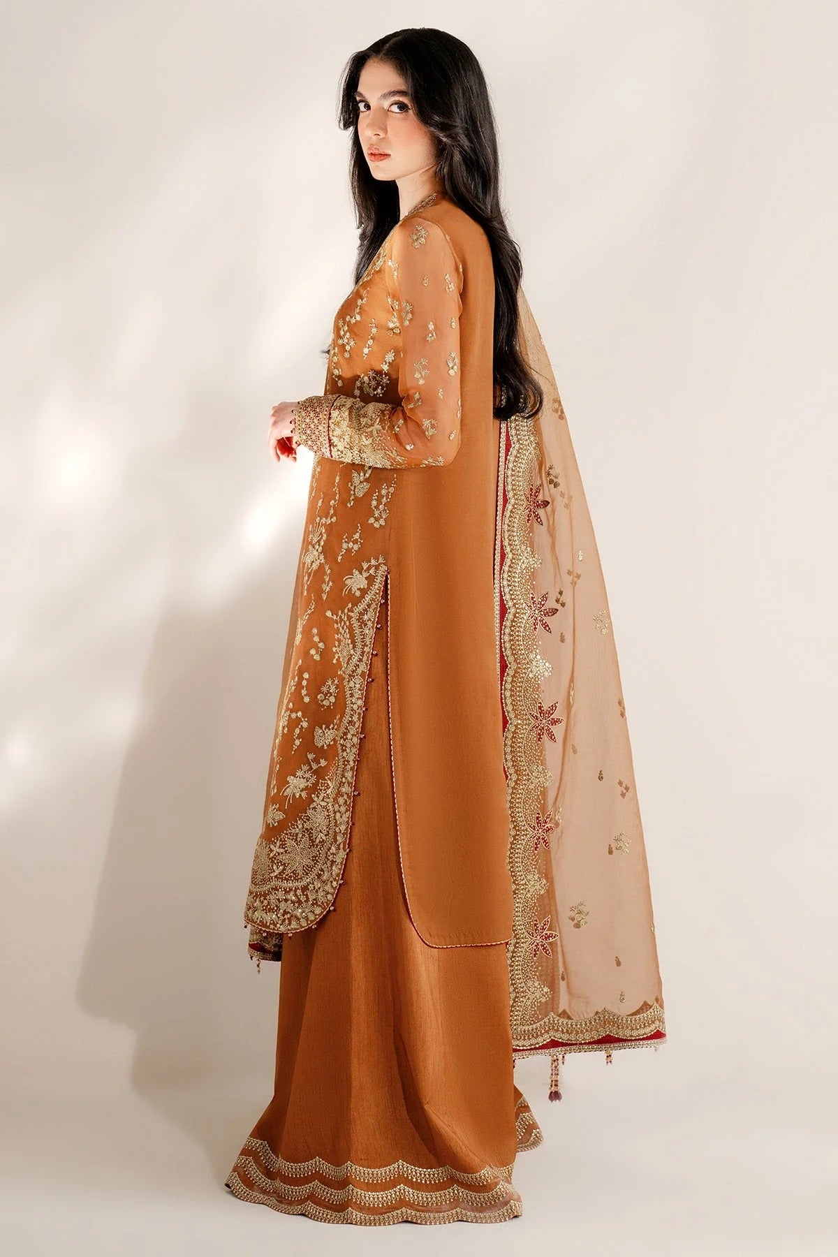 Chiffon and rawsilk elegance with intricate embroidery and organza dupatta. Ideal for formal wear and events. Make a bold style statement in UC-3077.