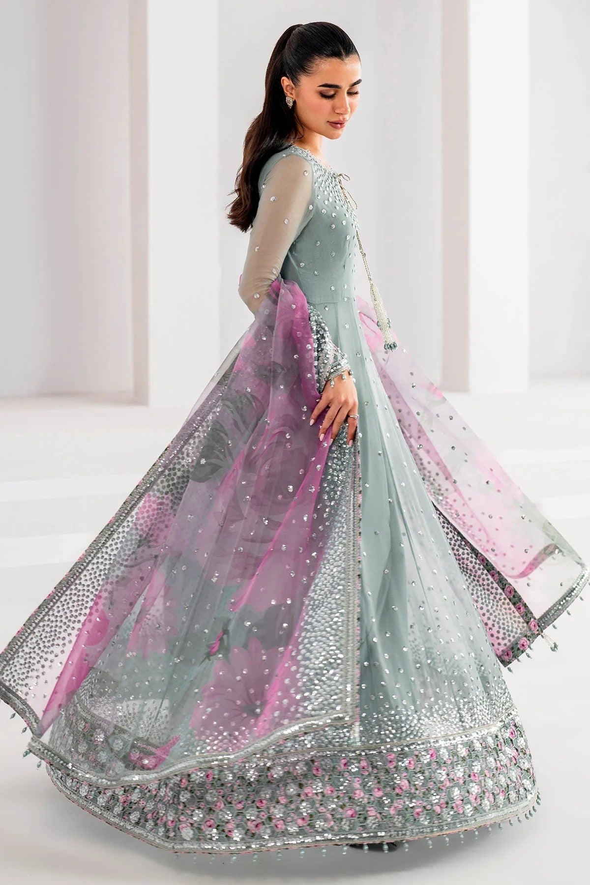 UC-3062 blends embroidered chiffon with digital prints, organza dupatta, and rawsilk trouser—crafted for elegance and perfect for formal occasions.