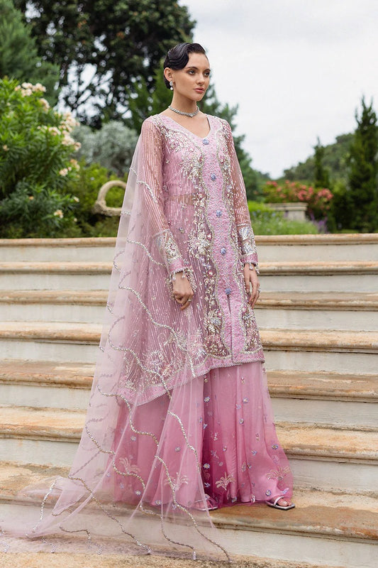 Stylish light pink dress with embroidered net shirt, sequined dupatta, embellished trouser, silk neckline, and handmade tassels for an elegant look.
