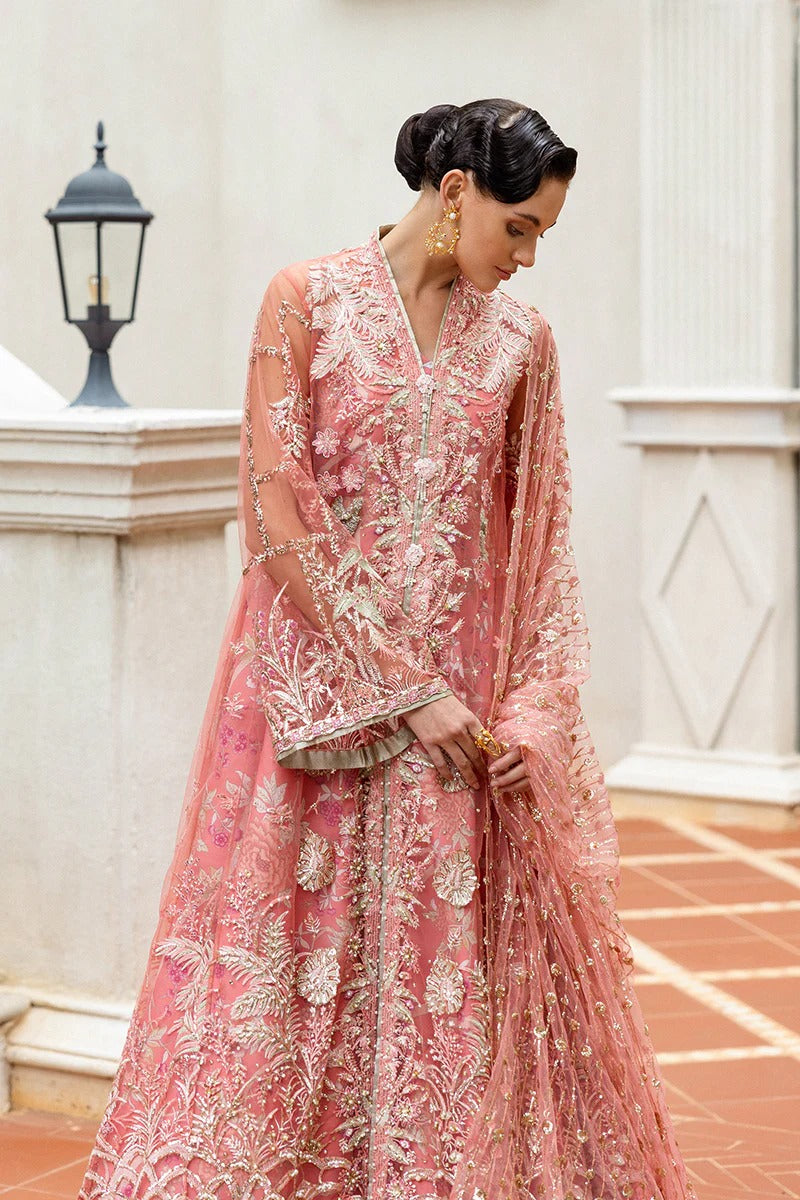Elegant coral dress with embroidered net shirt, sequined dupatta, raw silk trouser, 3D bird embellishments, and handmade tassels for luxury style.