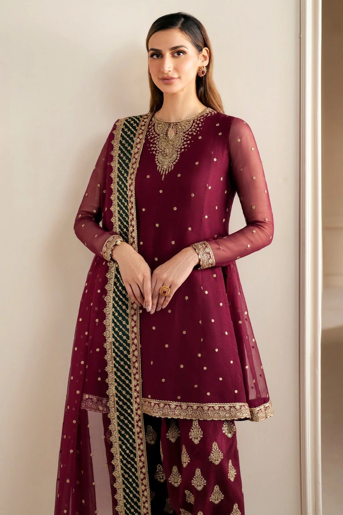 UC-3068 features delicate embroidery on chiffon panels, sleeves, and dupatta—paired with a rawsilk bottom and dyed border. Perfect for formal occasions.