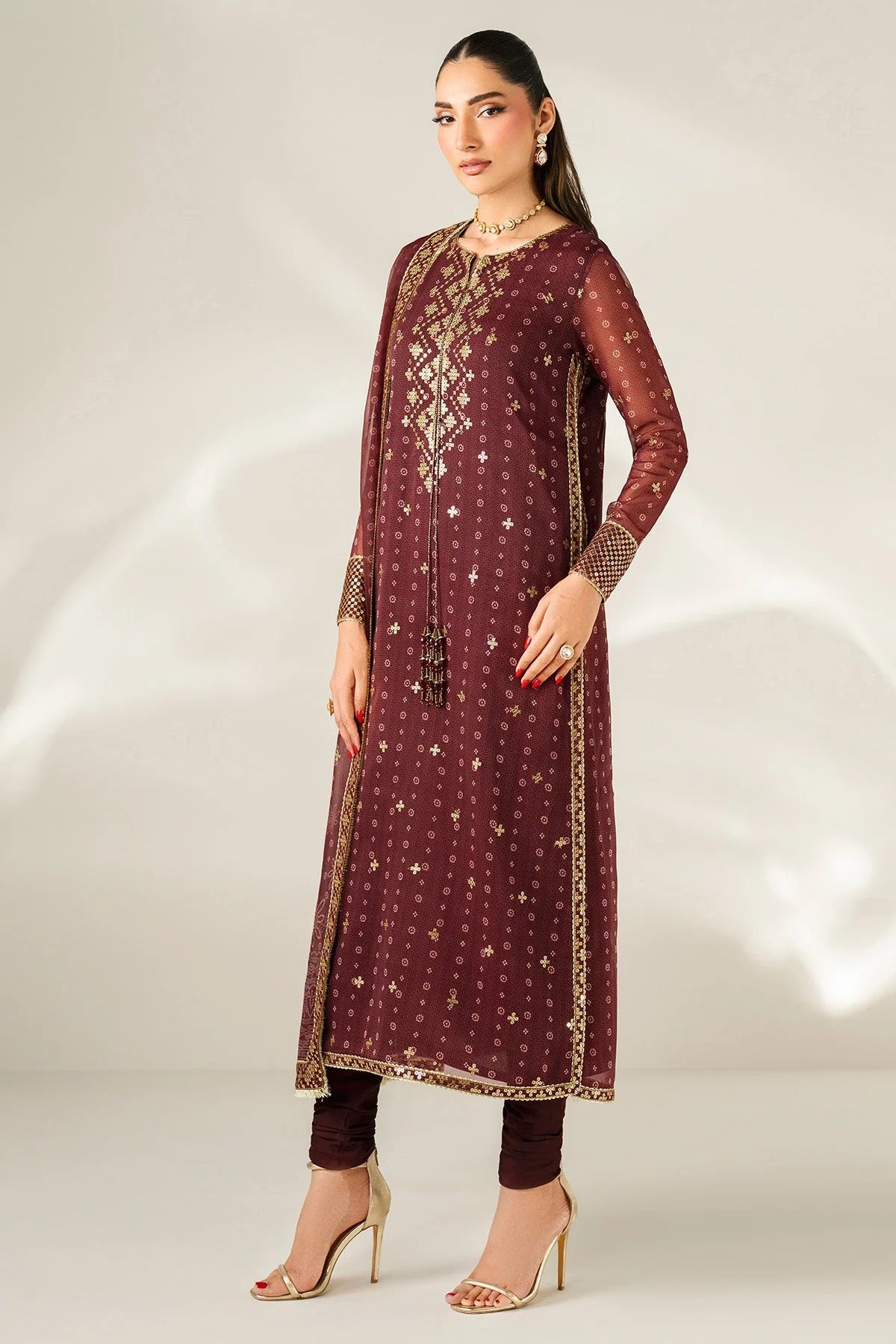 Digitally printed chiffon with intricate embroidery, bordered dupatta, and dyed raw silk bottom—perfect for weddings, festive events, or formal wear.