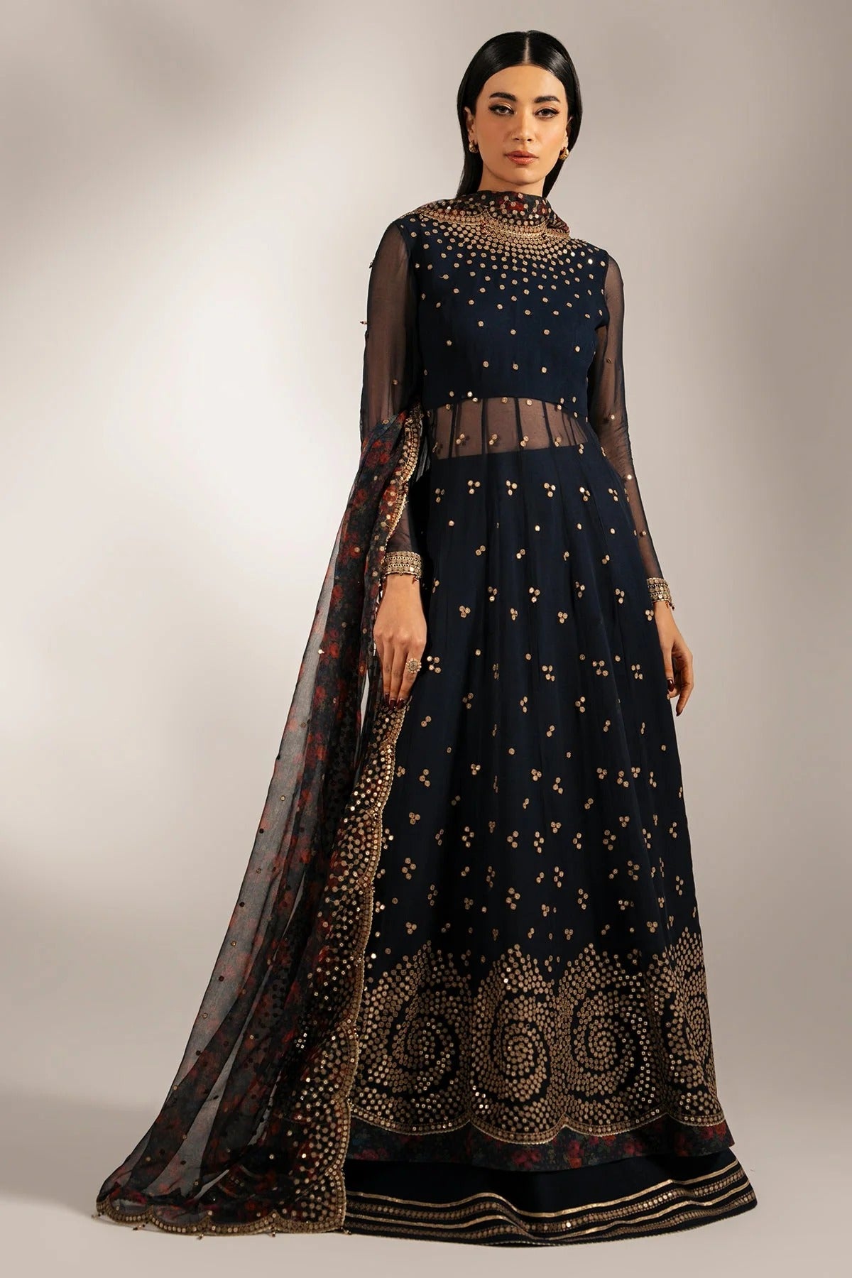 Intricately embroidered chiffon with digital print dupatta & rawsilk bottom—perfect for formal occasions. A luxurious look in every detail. Shop UC-3073 now!