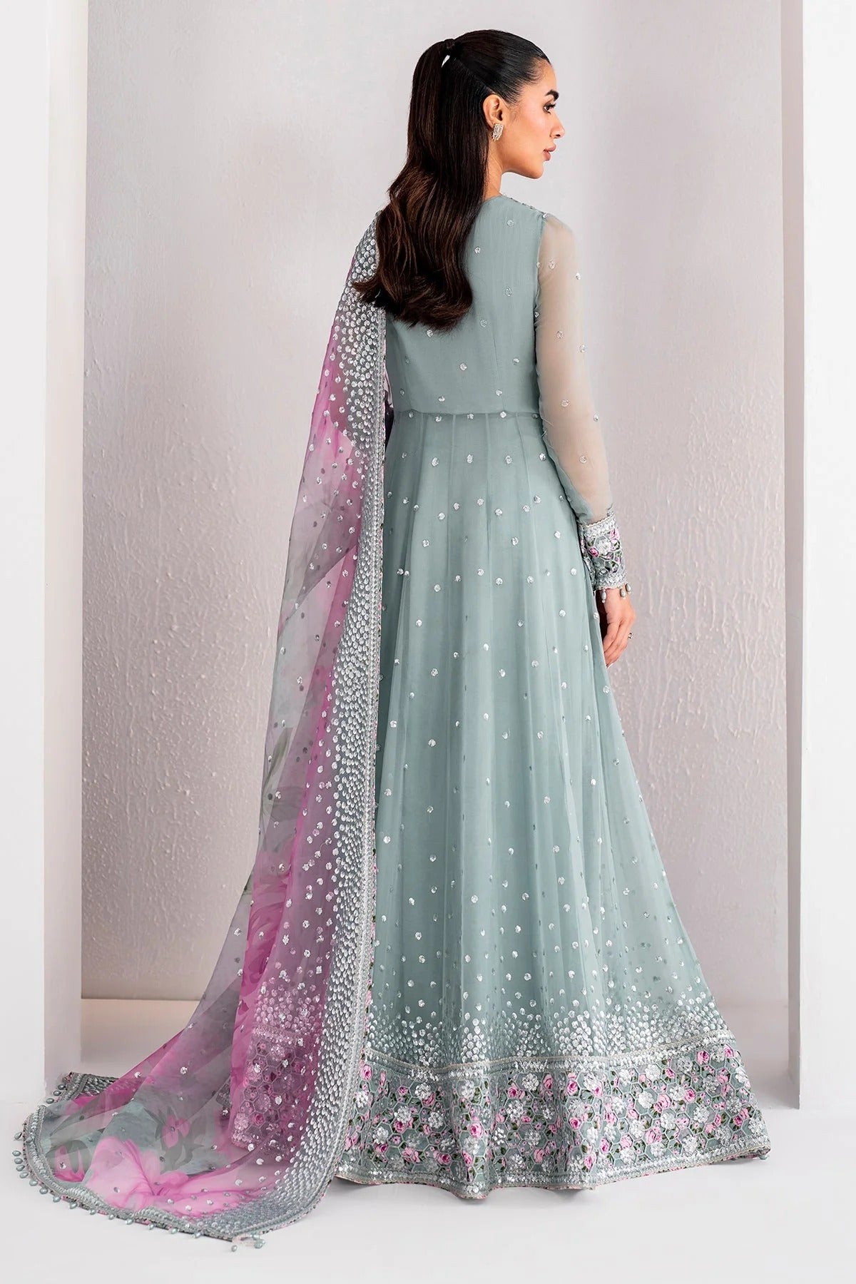 UC-3062 blends embroidered chiffon with digital prints, organza dupatta, and rawsilk trouser—crafted for elegance and perfect for formal occasions.
