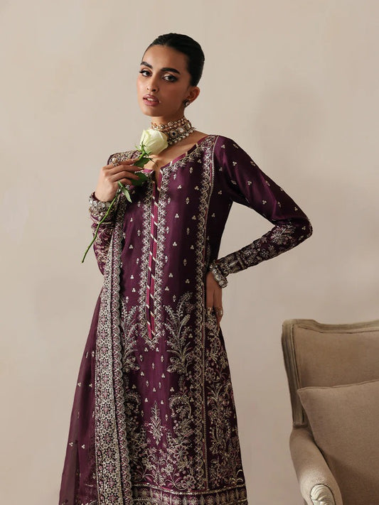 Luxurious raw silk outfit featuring embroidered and sequined panels, elegant chiffon dupatta with organza motifs, and matching dyed silk trouser.