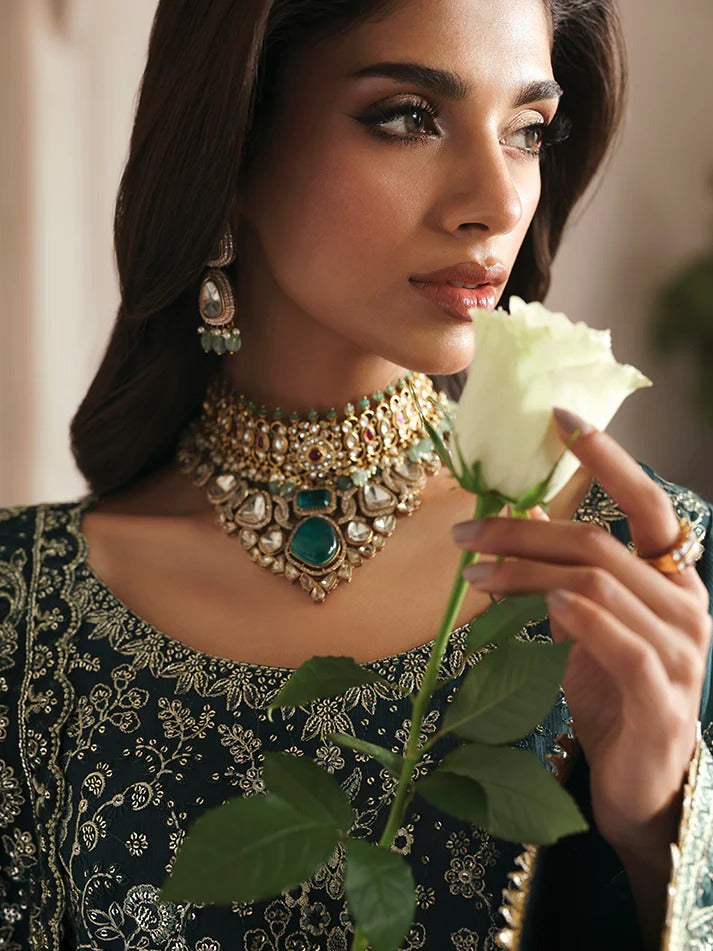 Elevate your look with this embroidered and sequined raw silk ensemble featuring a detailed bodice, chiffon dupatta with organza border, and elegant sharara.