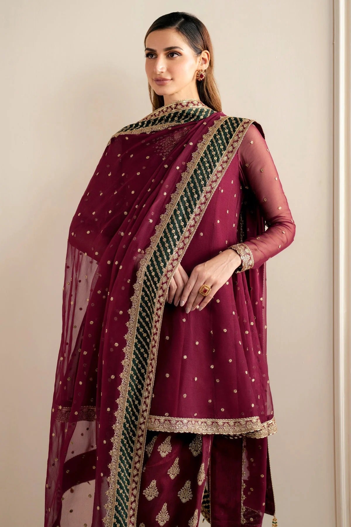 UC-3068 features delicate embroidery on chiffon panels, sleeves, and dupatta—paired with a rawsilk bottom and dyed border. Perfect for formal occasions.