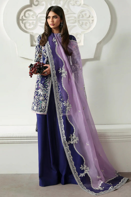 Elegant floral printed purple silk suit with embroidered panels, embellished organza dupatta, and matching silk trousers. A perfect outfit for festive & formal occasions.