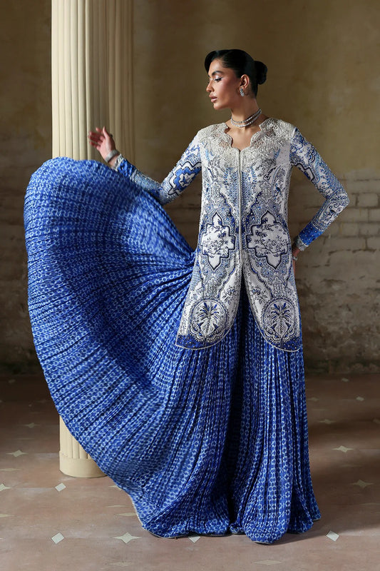 Elegant white blue printed silk suit with hand-embellished panels, embroidered dupatta,&   crushed sharara. Perfect for weddings, festive, and formal occasions.