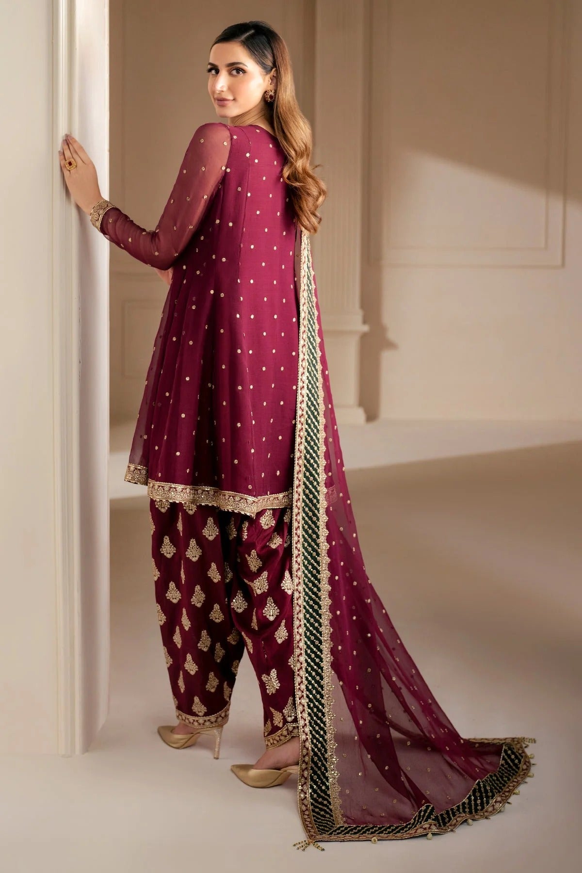 UC-3068 features delicate embroidery on chiffon panels, sleeves, and dupatta—paired with a rawsilk bottom and dyed border. Perfect for formal occasions.