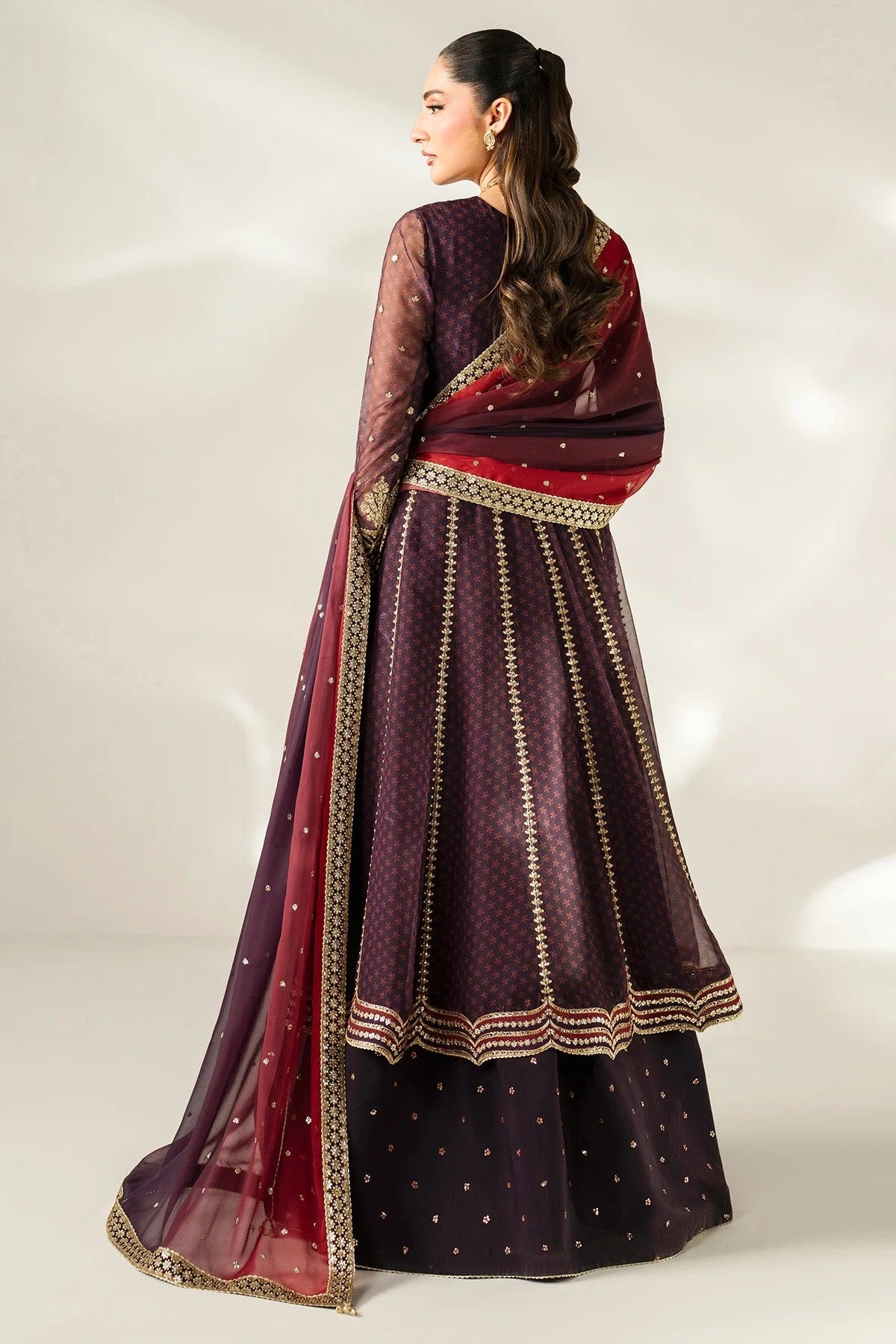 Intricately embroidered chiffon suit with digital prints, bordered dupatta, and raw silk bottom—crafted for timeless elegance and formal sophistication.