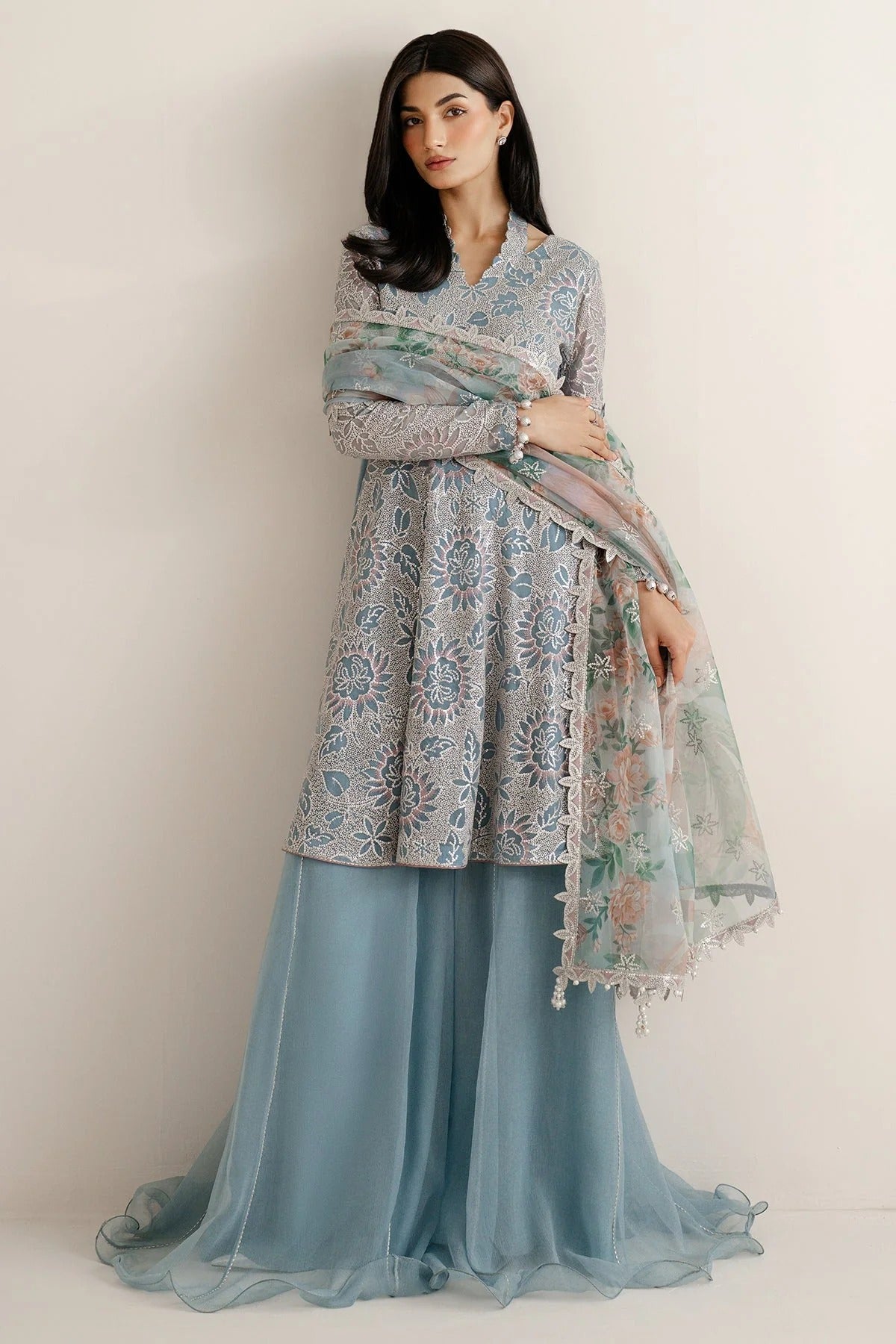 Featuring embroidered chiffon, organza dupatta, and rawsilk bottom, UC-3075 blends tradition and style—perfect for formal events and festive wear.