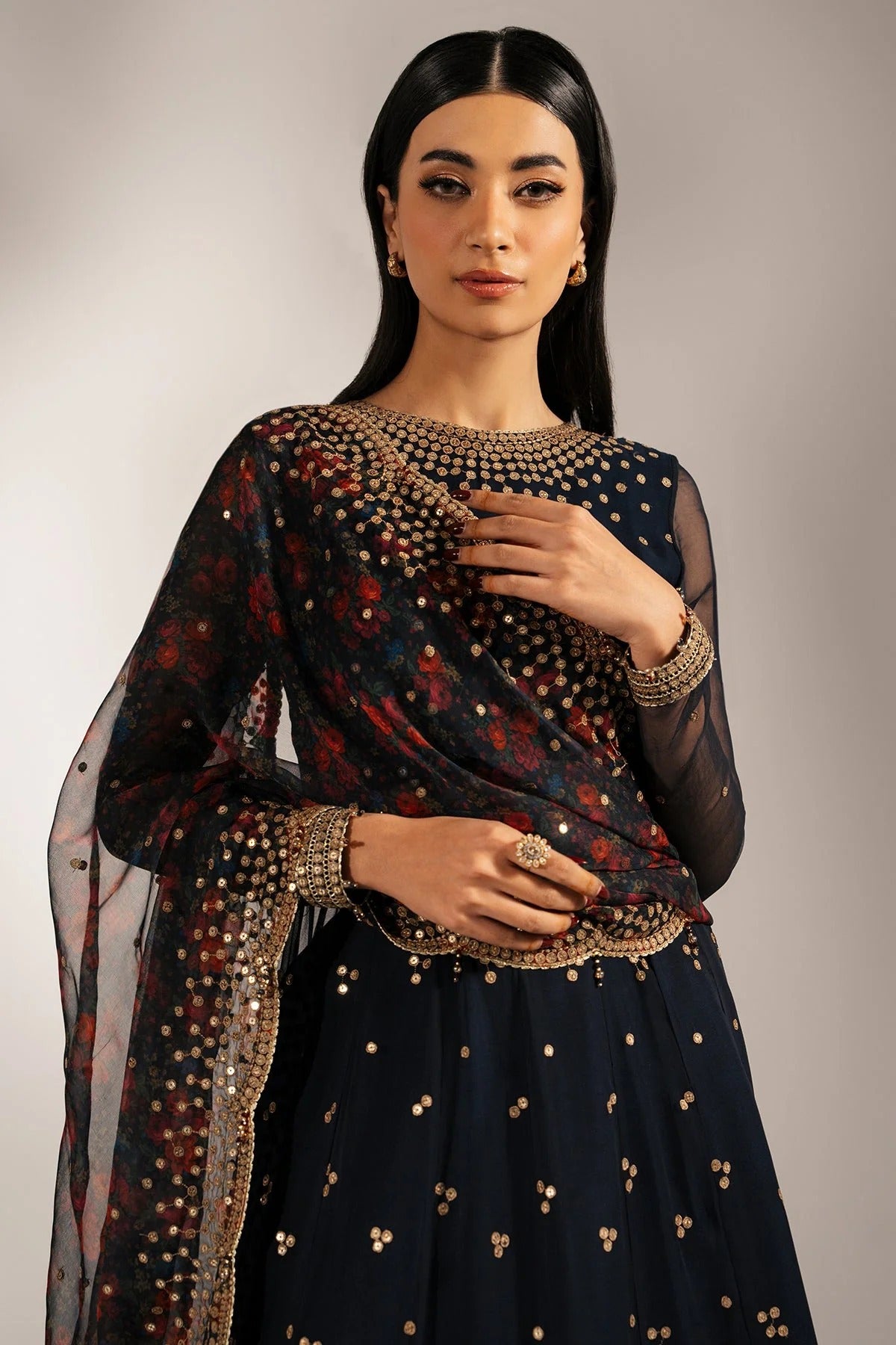 Intricately embroidered chiffon with digital print dupatta & rawsilk bottom—perfect for formal occasions. A luxurious look in every detail. Shop UC-3073 now!
