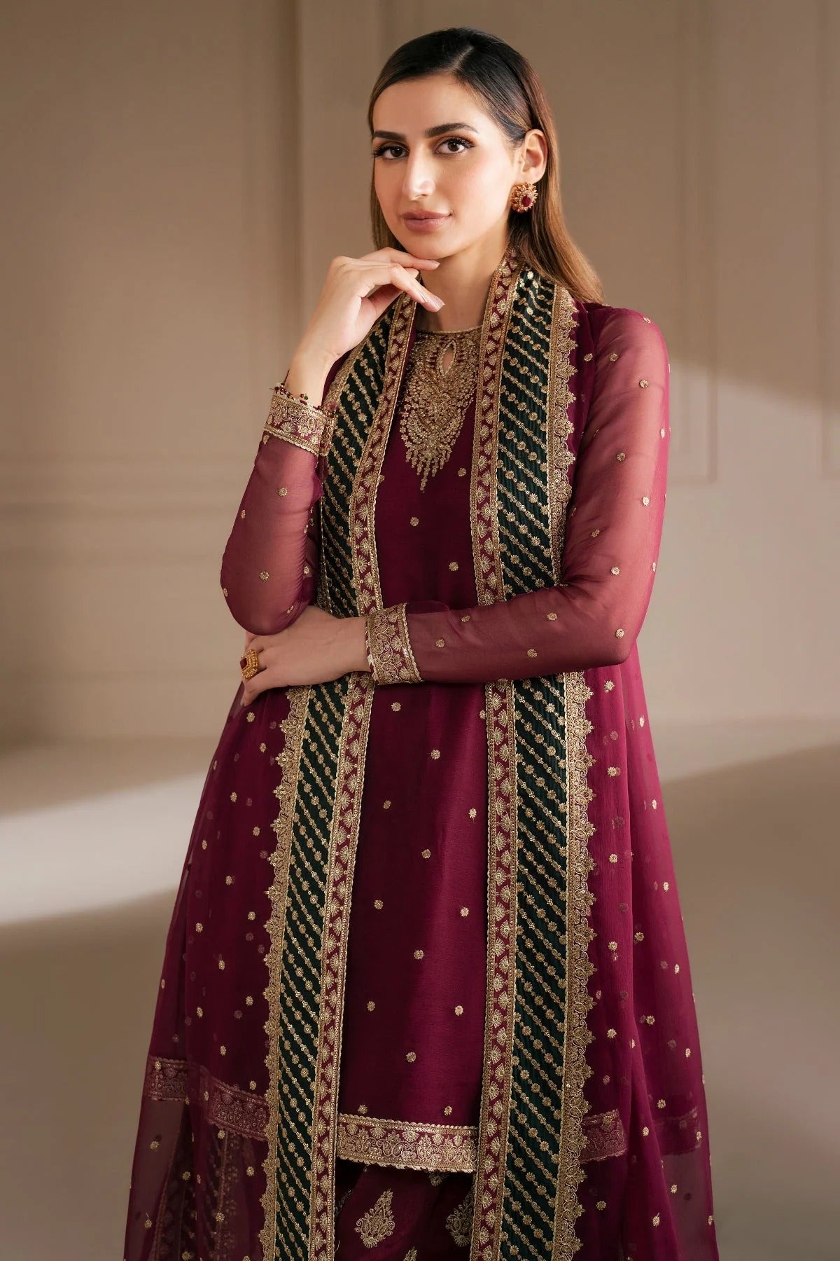 UC-3068 features delicate embroidery on chiffon panels, sleeves, and dupatta—paired with a rawsilk bottom and dyed border. Perfect for formal occasions.