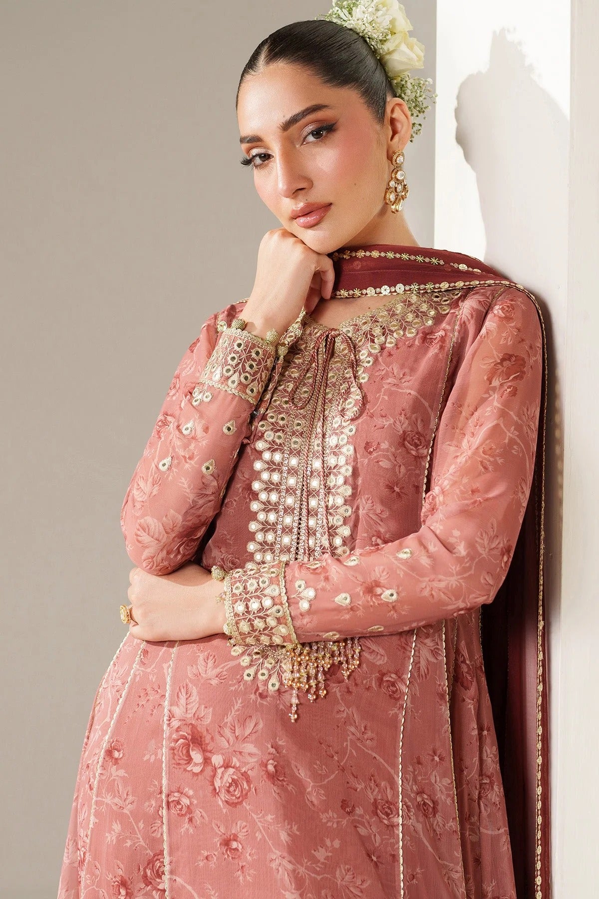 Digitally printed chiffon suit with embroidered borders & dupatta. Features rawsilk bottom for a rich, elegant look. Perfect for formal & festive wear.