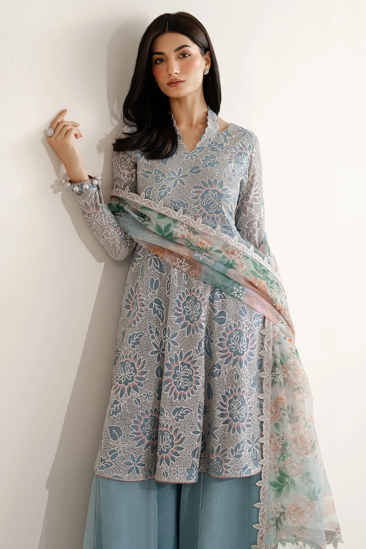 Featuring embroidered chiffon, organza dupatta, and rawsilk bottom, UC-3075 blends tradition and style—perfect for formal events and festive wear.