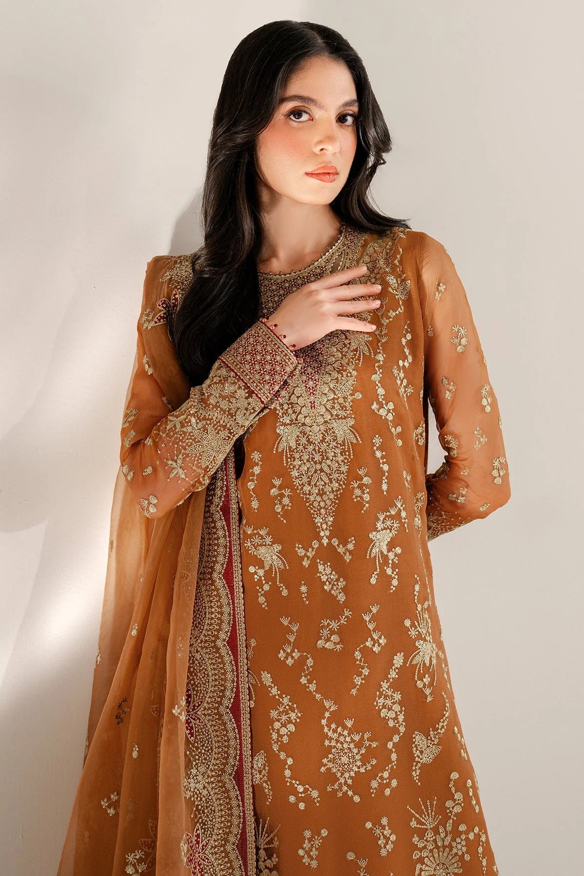 Chiffon and rawsilk elegance with intricate embroidery and organza dupatta. Ideal for formal wear and events. Make a bold style statement in UC-3077.