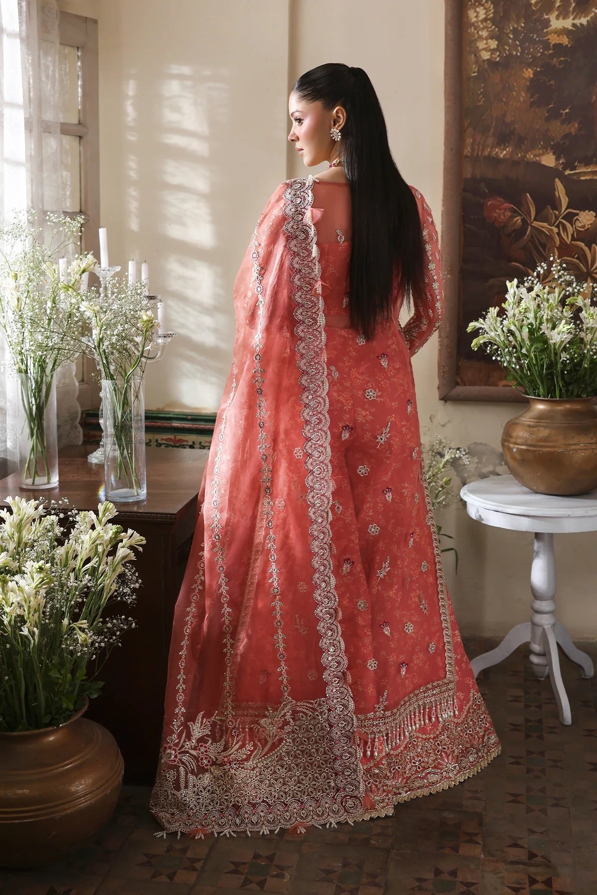 Chic coral organza dress with rich embroidery, magenta dupatta, and digital printed bustier & trouser. Perfect for festive and luxury fashion moments.