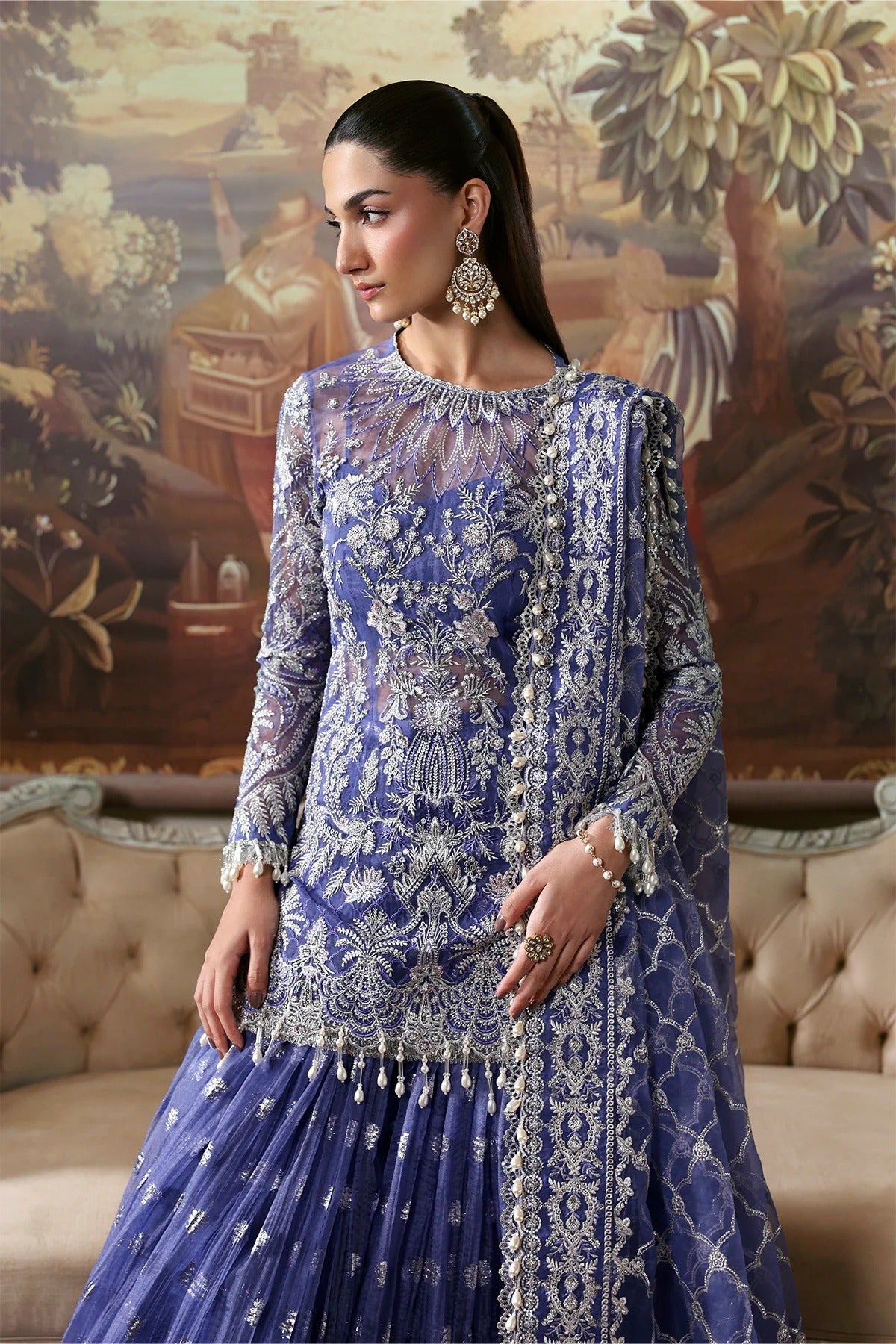 Elegant blue organza dress featuring intricate embroidery, detailed dupatta borders, and dyed trousers. A graceful pick for festive or formal events.