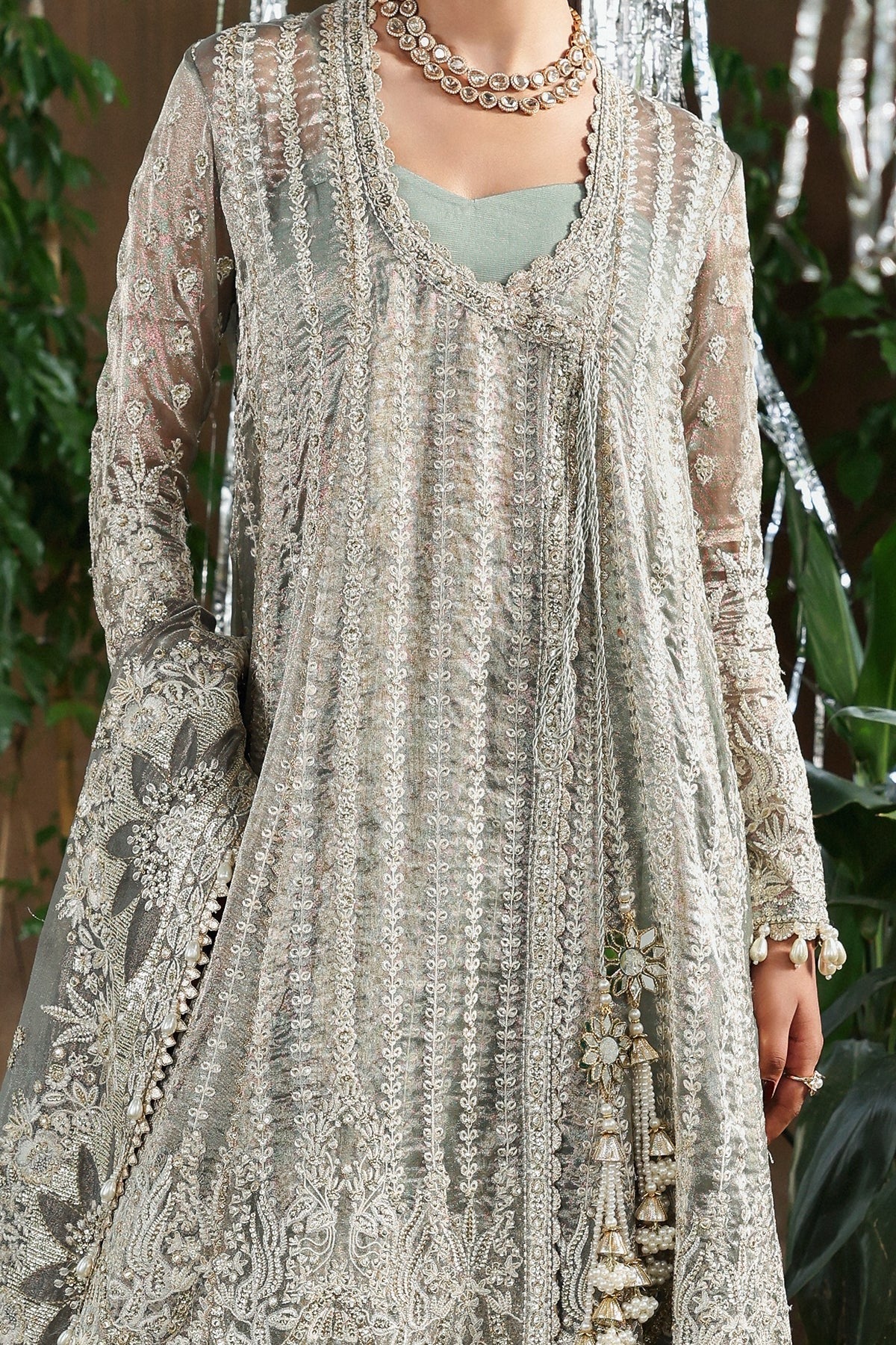 Refined dusty grey viscose outfit with zari embroidery, open front border, dupatta, and raw silk trouser. Perfect for formal and festive occasions.