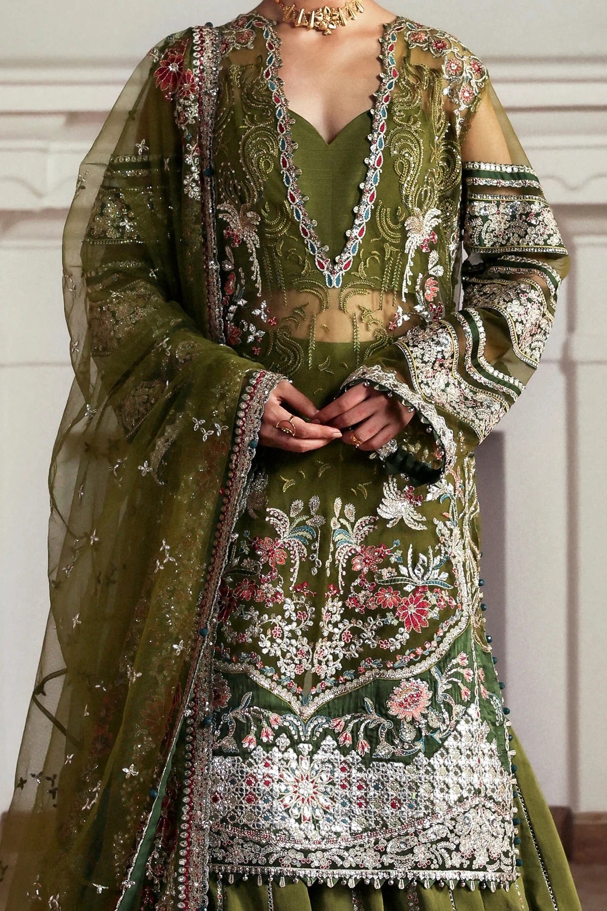 Elegant olive net and green viscose silk embroidered panels, sleeves, dupatta, and trousers with detailed borders for a graceful and stylish custom outfit.