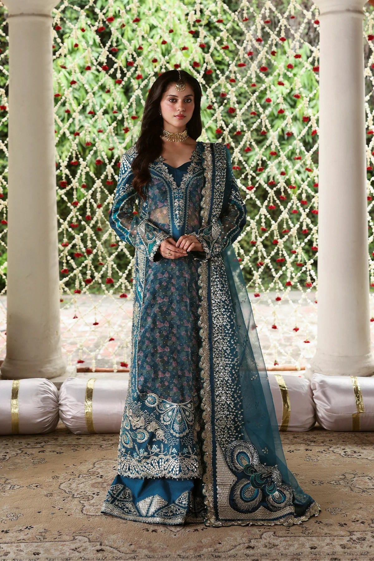 Shop sea green organza and raw silk fabric with intricate digital prints, embroidered sleeves, borders, patches, and dupatta for a stunning custom dress design.