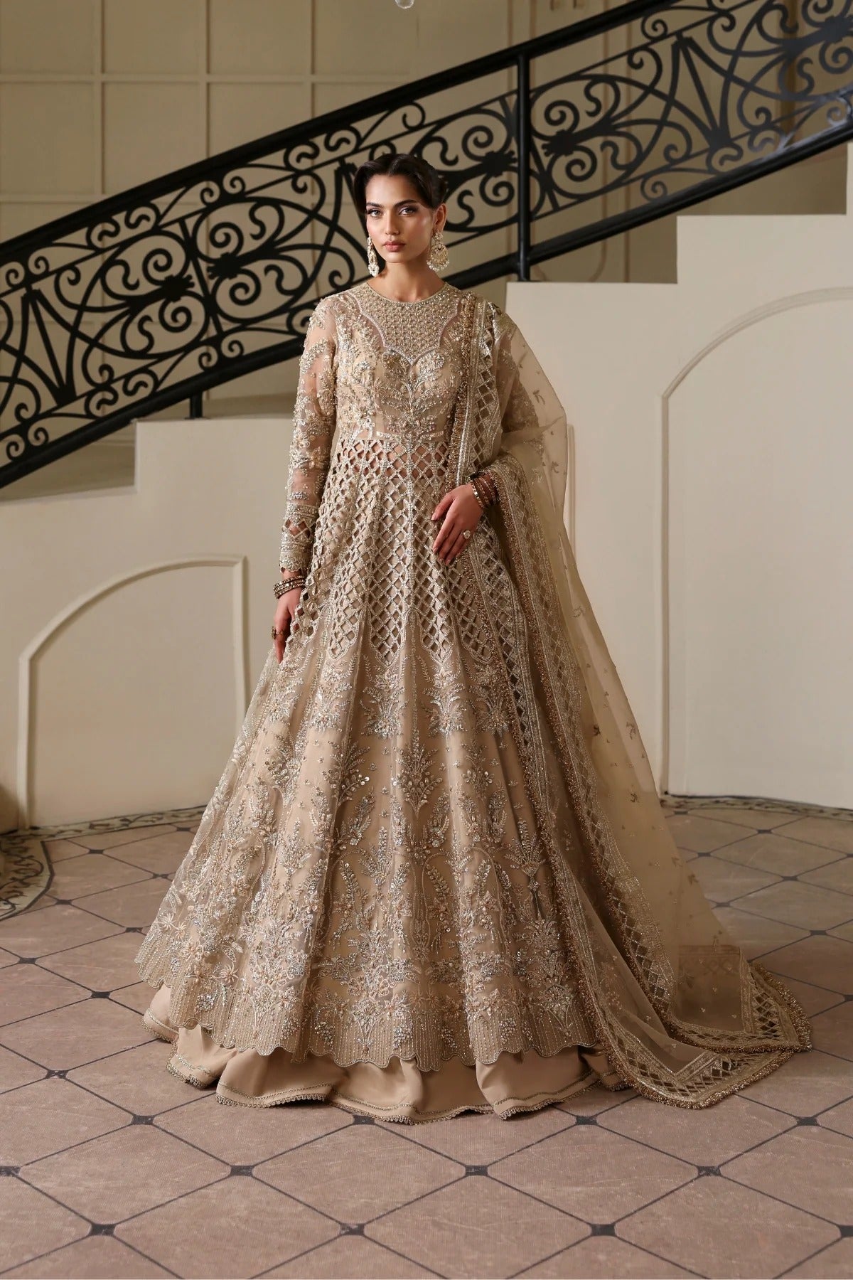 Luxurious hand-embellished organza dress with detailed panels, embroidered dupatta, Russian grip inner, and raw silk lehenga fabric for a regal ensemble.