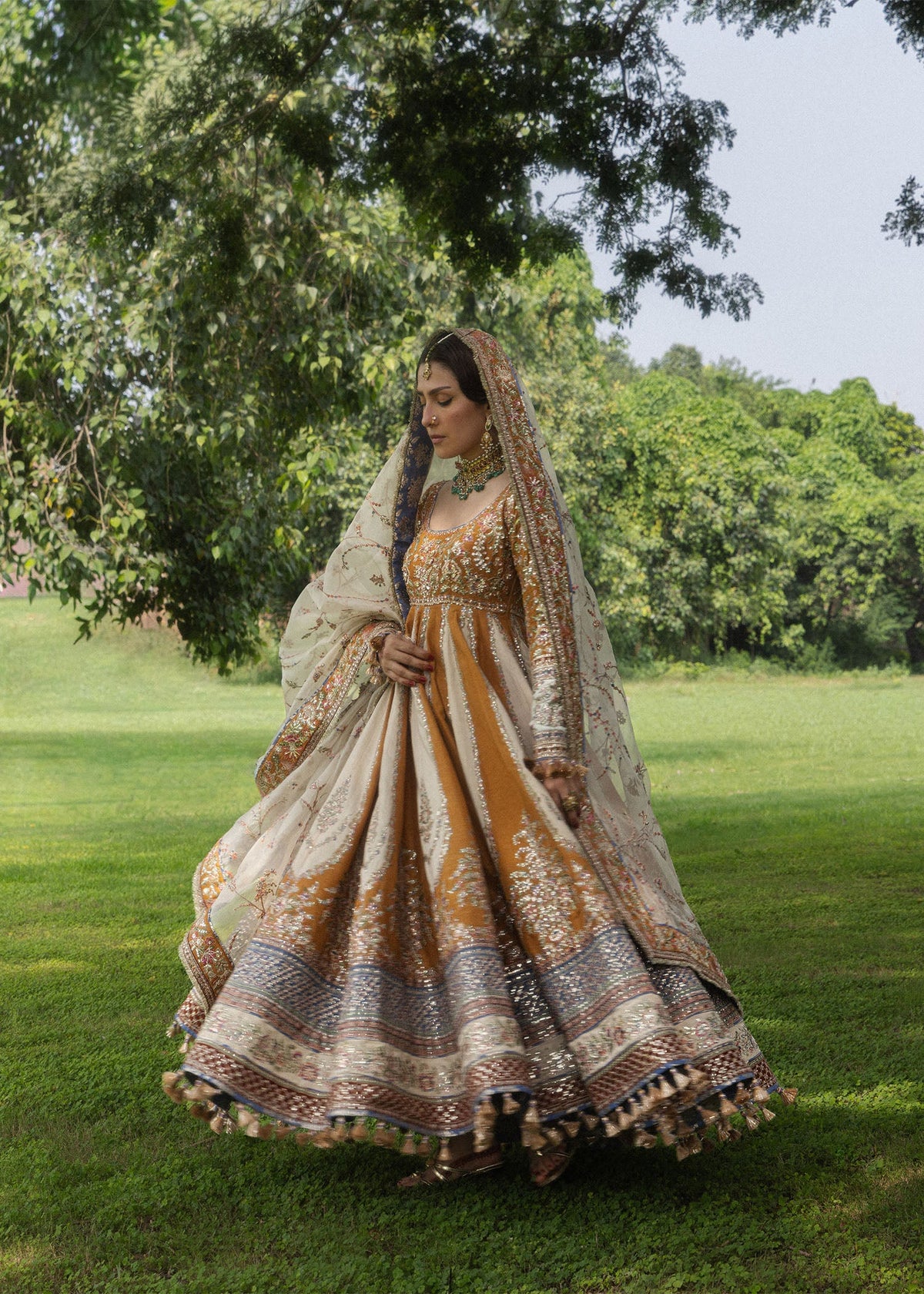 Hussain Rehar Mehru mustard pashwas with indigo churidar and ivory dupatta