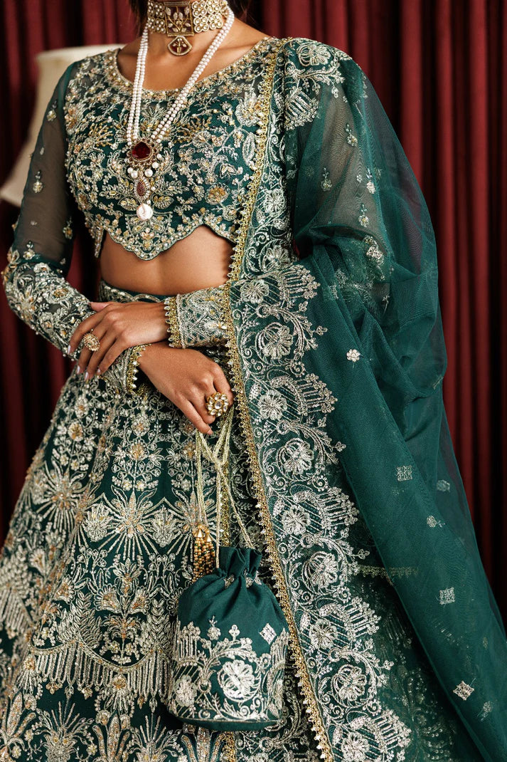 Beautiful net embroidered lehenga with hand embellished panels & sleeves. Includes net dupatta, organza belt, and 6 yards Russian grip inner fabric.