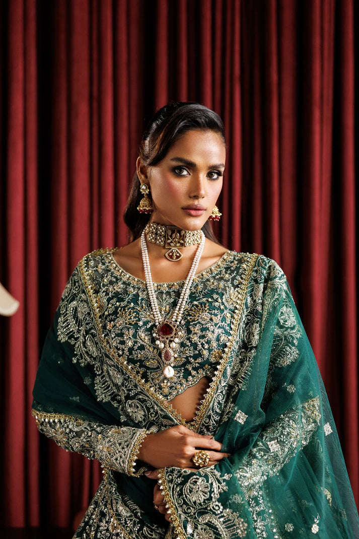 Beautiful net embroidered lehenga with hand embellished panels & sleeves. Includes net dupatta, organza belt, and 6 yards Russian grip inner fabric.