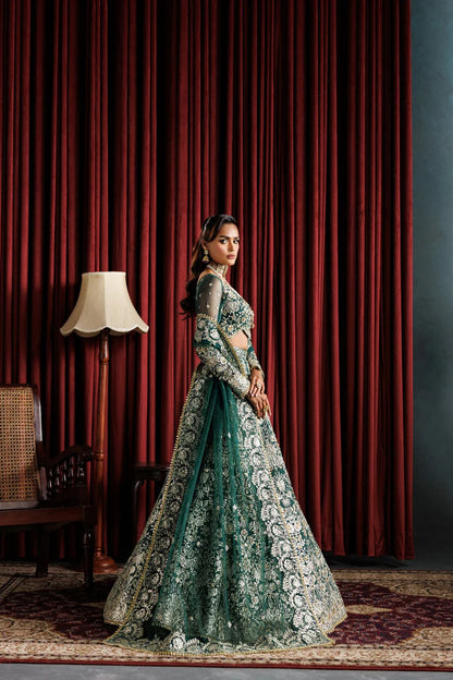 Beautiful net embroidered lehenga with hand embellished panels & sleeves. Includes net dupatta, organza belt, and 6 yards Russian grip inner fabric.