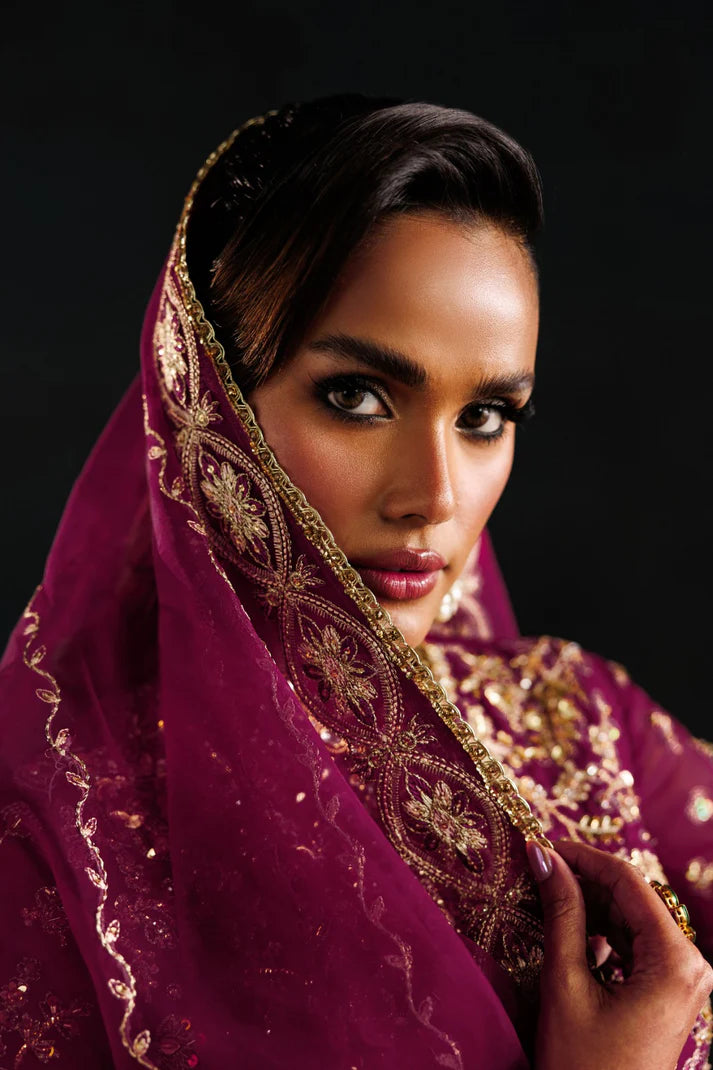 Elegant organza embroidered lehenga with hand embellished panels, sleeves & dupatta. Includes raw silk lehenga and Russian grip inner fabric.