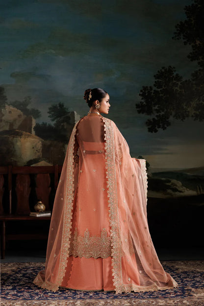 Elegant organza embroidered dress with hand embellished panels, sleeves & borders. Includes dupatta, raw silk trouser and inner fabric.