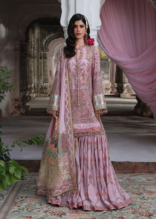 Elegant lilac chiffon ensemble with embroidered short shirt, flowing gharara and chiffon dupatta featuring organza pallu and four-sided borders for festive occasions.